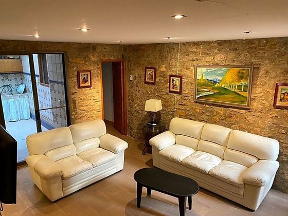 Foto 1 de Casa adosada en venta en Alfara de Carles de 4 habitaciones con jardín y aire acondicionado
