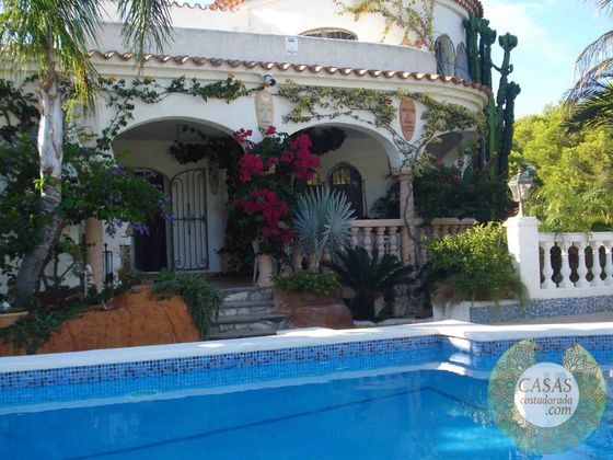 Foto 1 de Casa en venta en L'Ametlla de Mar de 3 habitaciones con piscina y jardín