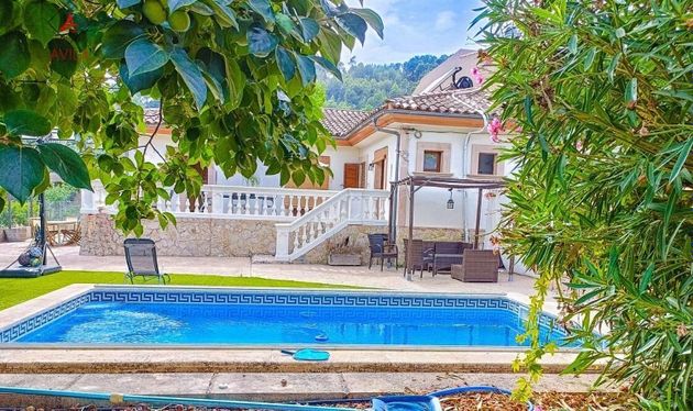 Foto 1 de Casa en venta en Puigpunyent de 4 habitaciones con terraza y piscina
