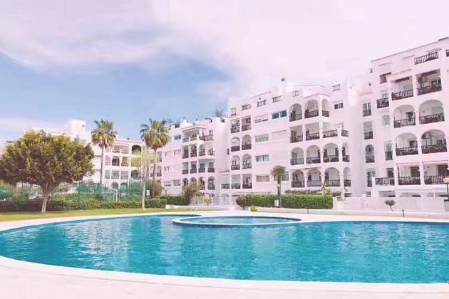 Foto 1 de Piso en venta en Marina Botafoc - Platja de Talamanca de 2 habitaciones con piscina y jardín