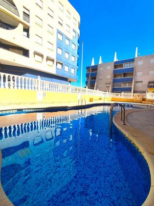 Foto 1 de Venta de piso en Torrelamata - La Mata de 2 habitaciones con terraza y piscina
