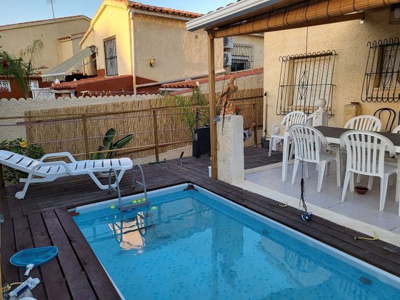 Foto 1 de Casa adossada en venda a calle San Fulgencio la Marina a de 2 habitacions amb terrassa i piscina