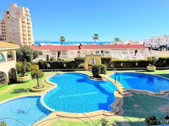 Foto 1 de Pis en venda a Playa de los Locos de 2 habitacions amb terrassa i piscina