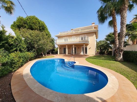 Foto 1 de Xalet en venda a Cabo Roig - La Zenia de 6 habitacions amb terrassa i piscina