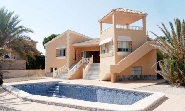 Foto 2 de Chalet en venta en Playa del Esparto-Veneziola de 3 habitaciones con terraza y piscina