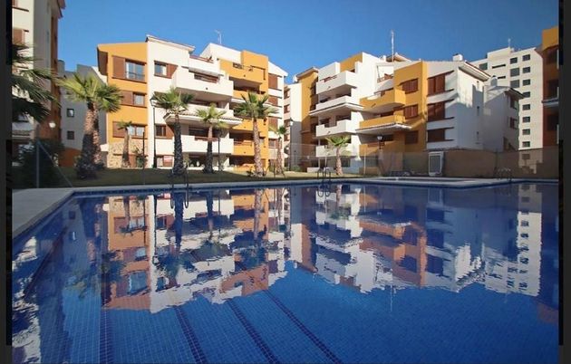 Foto 1 de Àtic en venda a urbanización Punta Prima de 3 habitacions amb terrassa i piscina
