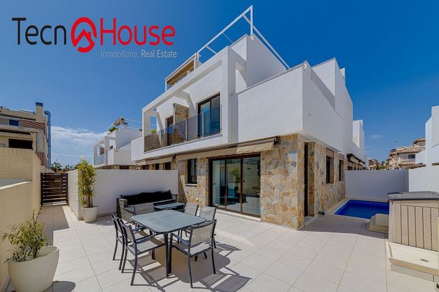 Foto 1 de Casa en venda a Cabo Roig - La Zenia de 3 habitacions amb terrassa i piscina