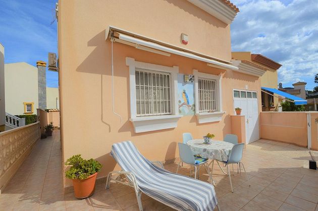 Foto 1 de Casa adossada en venda a Cabo Roig - La Zenia de 3 habitacions amb terrassa i piscina