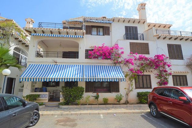 Foto 1 de Casa adossada en venda a Cabo Roig - La Zenia de 4 habitacions amb terrassa i piscina