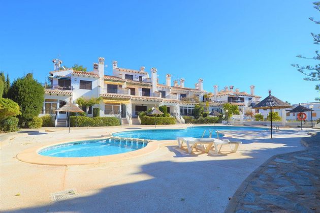 Foto 2 de Venta de casa adosada en Cabo Roig - La Zenia de 4 habitaciones con terraza y piscina