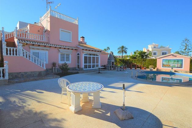 Foto 1 de Xalet en venda a Cabo Roig - La Zenia de 5 habitacions amb terrassa i piscina