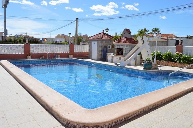 Foto 2 de Venta de casa en Dehesa de Campoamor - La Regia - Aguamarina de 5 habitaciones con terraza y piscina