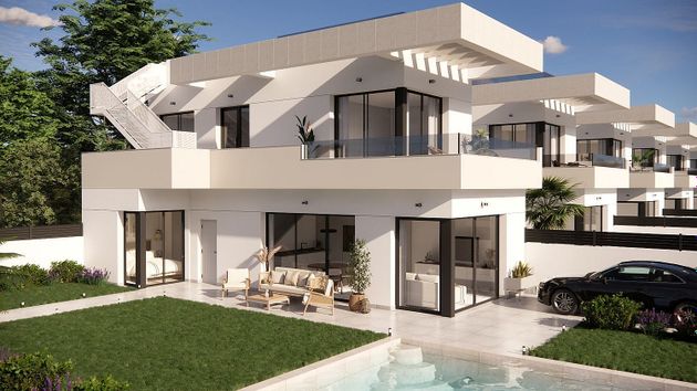 Foto 1 de Casa adossada en venda a calle La Herrada de 3 habitacions amb terrassa i piscina