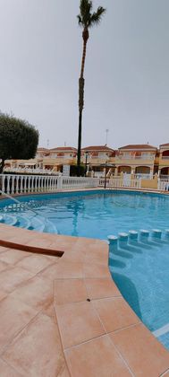 Foto 1 de Venta de casa adosada en Cabo Roig - La Zenia de 2 habitaciones con terraza y piscina