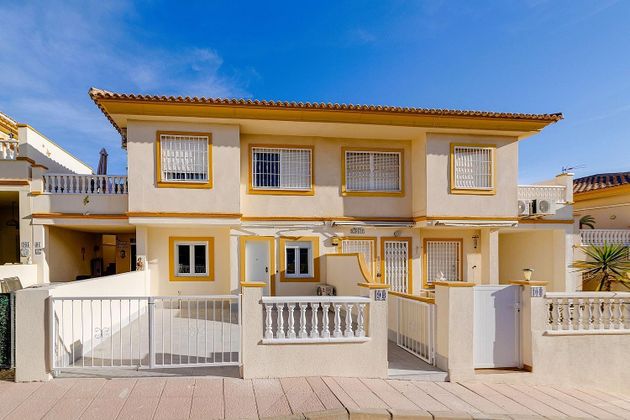 Foto 1 de Casa en venda a Playa Flamenca - Punta Prima de 2 habitacions amb terrassa i piscina