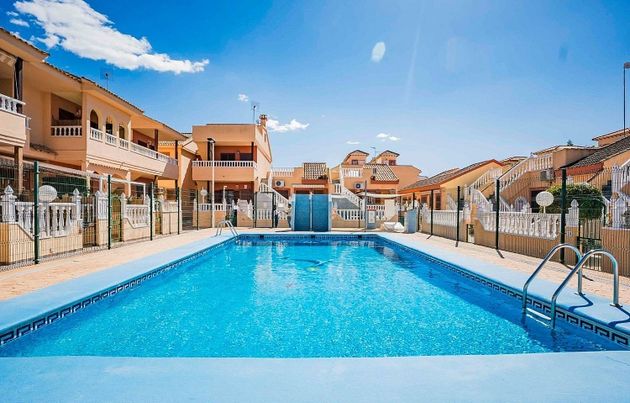 Foto 1 de Casa adossada en venda a La Siesta - El Salado - Torreta de 2 habitacions amb terrassa i piscina