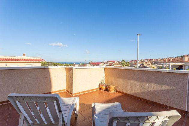 Foto 1 de Casa adosada en venta en Gran Alacant de 3 habitaciones con terraza y piscina