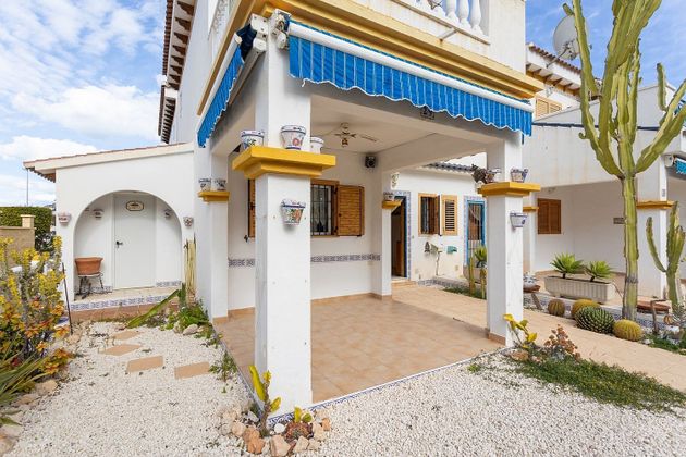 Foto 1 de Venta de casa adosada en Torrelamata - La Mata de 2 habitaciones con terraza y piscina