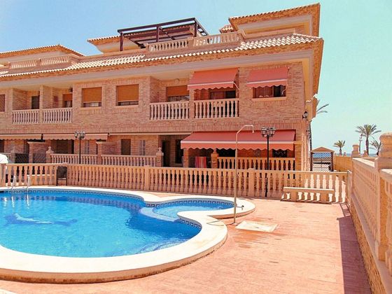 Foto 1 de Casa adosada en venta en calle Vistabella de 4 habitaciones con terraza y piscina