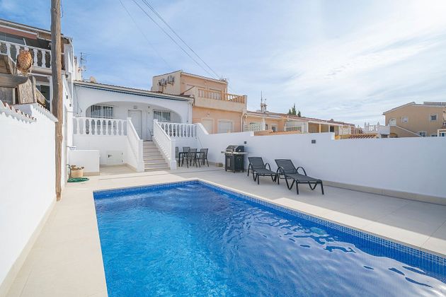 Foto 2 de Casa adosada en venta en calle Costa Balear de 2 habitaciones con terraza y piscina