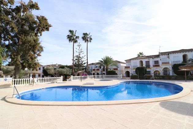 Foto 1 de Casa adossada en venda a San Miguel de Salinas de 1 habitació amb terrassa i piscina
