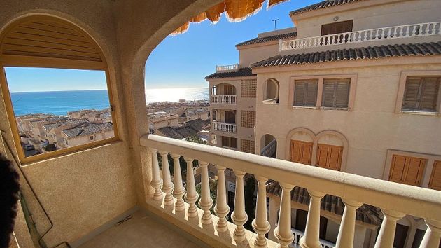 Foto 2 de Venta de piso en Torrelamata - La Mata de 3 habitaciones con terraza y jardín