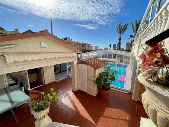 Foto 1 de Venta de casa adosada en Pueblo Poniente de 6 habitaciones con terraza y piscina