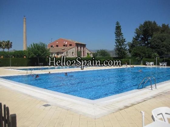 Foto 1 de Casa adossada en venda a calle Valenciano de 3 habitacions amb terrassa i piscina