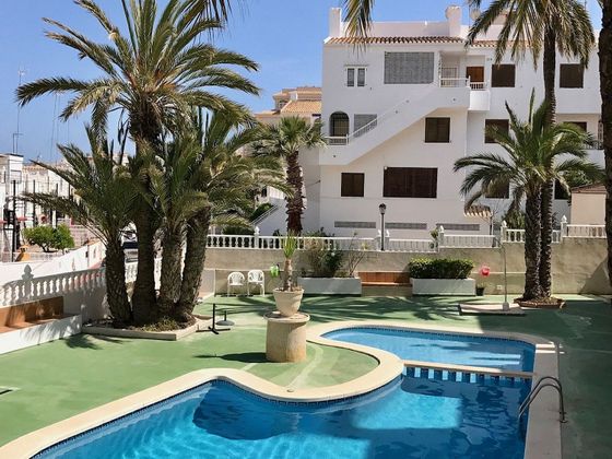 Foto 2 de Venta de casa adosada en Torrelamata - La Mata de 2 habitaciones con terraza y piscina