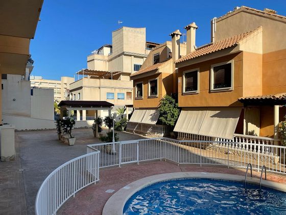 Foto 2 de Casa adosada en alquiler en calle Santa Pola de 4 habitaciones con terraza y piscina