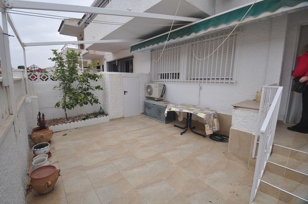 Foto 1 de Casa adossada en venda a Pueblo Español-Coveta Fumá de 4 habitacions amb terrassa i jardí