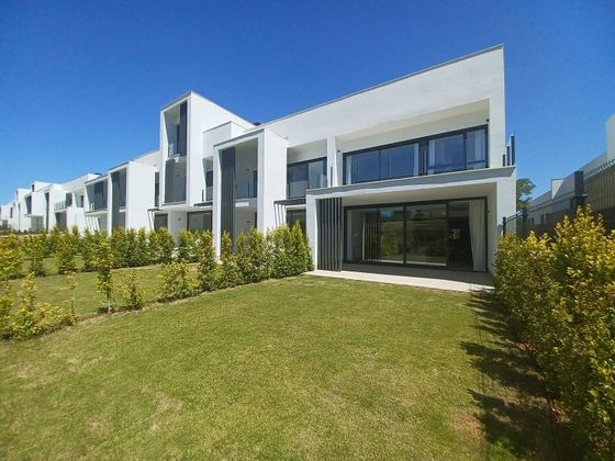 Foto 1 de Casa adossada en venda a urbanización San Roque Club de 3 habitacions amb terrassa i piscina