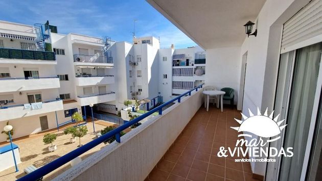 Foto 1 de Venta de piso en Playa de Garrucha de 2 habitaciones con terraza y piscina