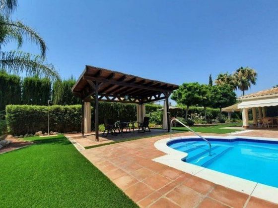 Foto 1 de Chalet en venta en Carlota (La) de 6 habitaciones con terraza y piscina