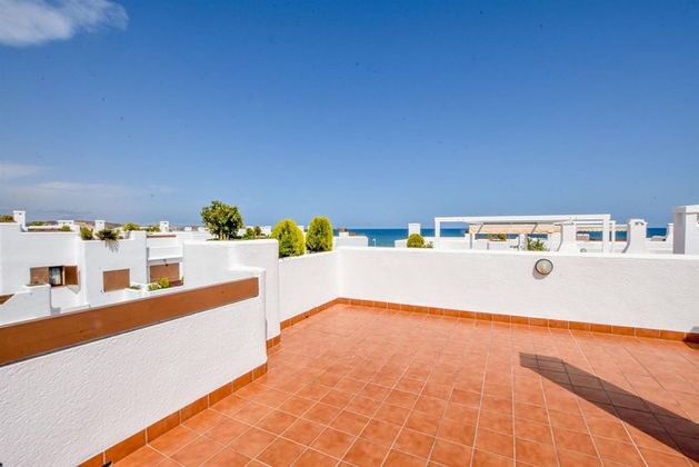 Foto 2 de Venta de casa adosada en San Juan de los Terreros de 4 habitaciones con terraza y piscina