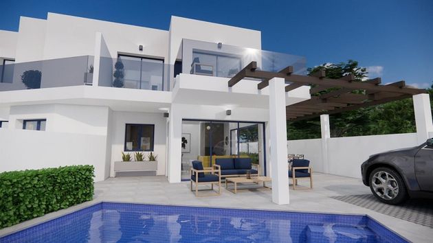 Foto 1 de Casa adossada en venda a Urb. El Palmeral de 3 habitacions amb terrassa i piscina