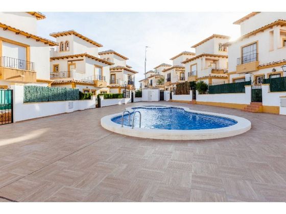 Foto 2 de Venta de casa adosada en Dehesa de Campoamor - La Regia - Aguamarina de 3 habitaciones con terraza y piscina