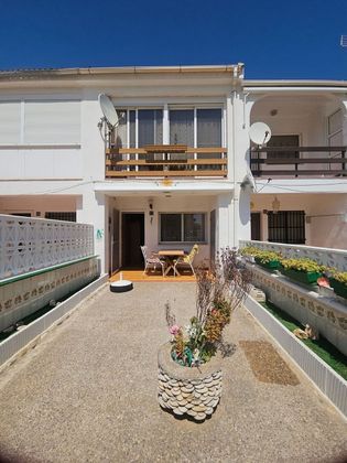 Foto 1 de Casa adossada en venda a Playa norte de 2 habitacions amb terrassa i jardí