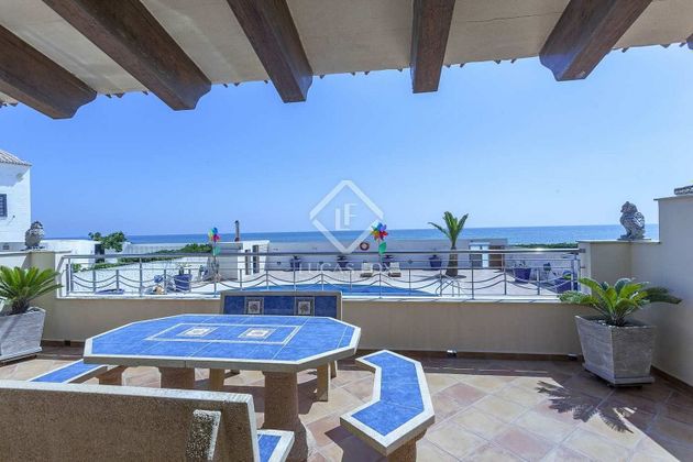 Foto 1 de Venta de casa en El Perellonet de 4 habitaciones con terraza y piscina