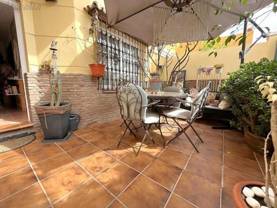 Foto 1 de Casa adosada en venta en Polígonos - Recinto Ferial Cortijo de Torres de 4 habitaciones con terraza y piscina