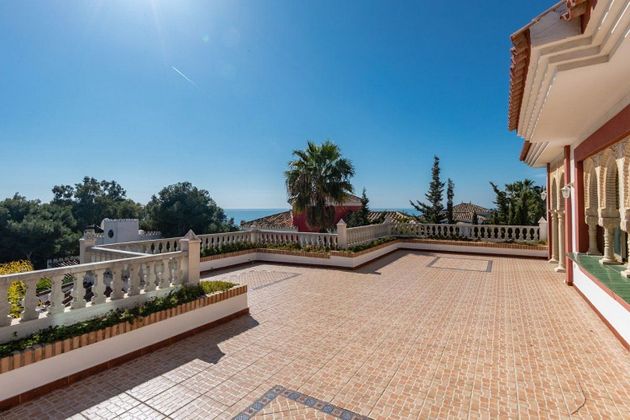 Foto 1 de Venta de chalet en Riviera del Sol de 7 habitaciones con terraza y piscina