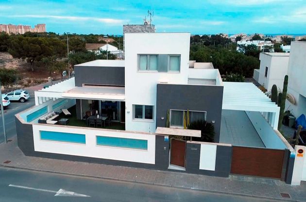 Foto 1 de Casa en venda a Mil Palmeras de 3 habitacions amb terrassa i piscina