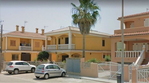 Foto 2 de Venta de casa en El Perelló - Les Palmeres - Mareny de Barraquetes de 5 habitaciones con terraza y piscina