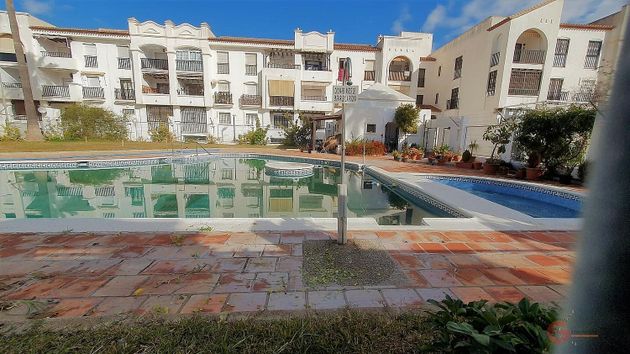 Foto 1 de Piso en venta en Playa de Granada de 2 habitaciones con piscina y ascensor