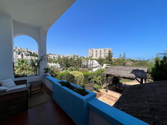 Foto 1 de Venta de casa adosada en Torrequebrada de 5 habitaciones con terraza y piscina