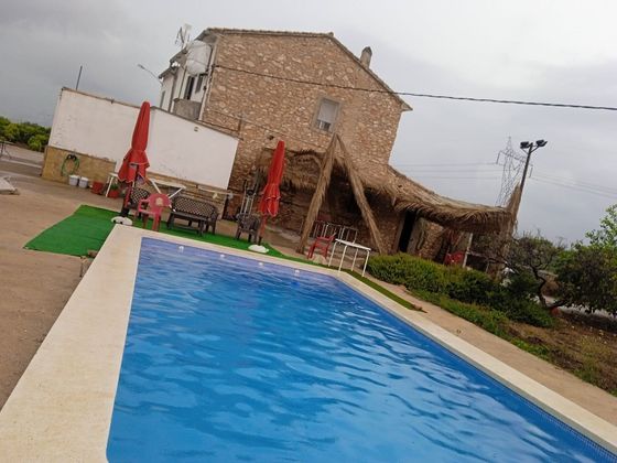 Foto 1 de Venta de casa rural en calle Pla de Museros de 4 habitaciones con terraza y piscina