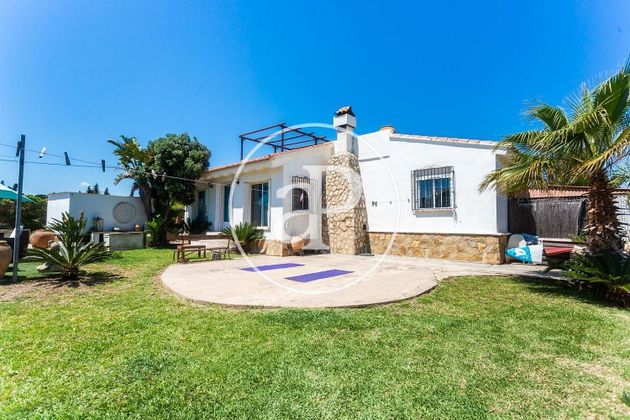 Foto 1 de Xalet en venda a Oliva Playa de 3 habitacions amb terrassa i jardí
