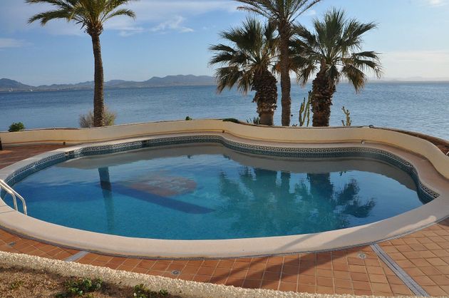 Foto 1 de Piso en alquiler en urbanización Cabo Romano de 2 habitaciones con terraza y piscina