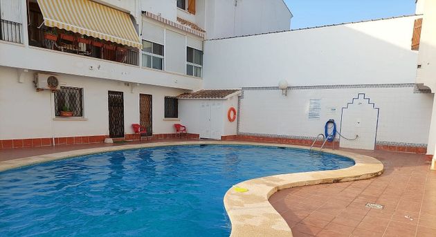 Foto 1 de Venta de casa adosada en calle Playa de Gandia Cullera de 3 habitaciones con piscina y balcón