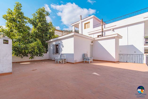 Foto 1 de Casa adossada en venda a calle Francisco Fernández González de 4 habitacions amb terrassa i jardí